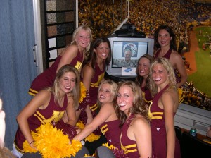 US Marine in Iraq hugs a group of Minnesota Gopher Cheerleaders in a luxury suite at a 2005 football game. Nobody cared who won the game after that.