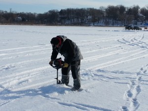 How to make fishing holes on a frozen lake in Minnesota.