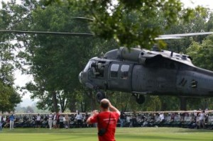 A Blackhawk helicopter “drops in” on Tee it up for the Troops 2009. The bald guy is Greg Scott recording video.